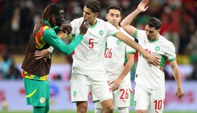 Soccer Football - CAF Africa Cup of Nations - Morocco 2025 - Final - Senegal v Morocco - Prince Moulay Abdellah Stadium, Rabat, Morocco - January 18, 2026 Senegal's Pathe Cis clashes with Morocco's Nayef Aguerd and Brahim Diaz after a penalty was awarded to Morocco following a VAR review REUTERS/Amr Abdallah Dalsh